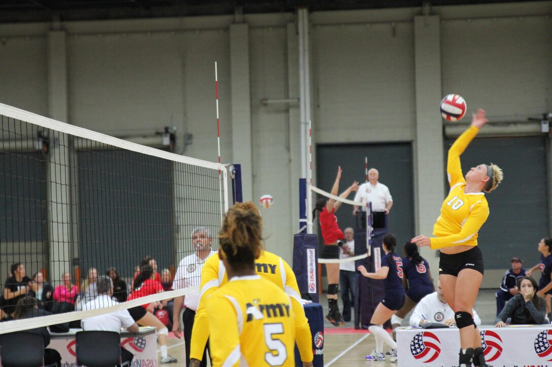 Army 1st Lt. Alexandra Giraud of Schofield Barracks, Hawaii spikes the ball during Army's gold medal run for their third straight year during the 2015 Armed Forces Volleyball Championship held in conjunction with the USA Volleyball National Championship at the COBO Center in Detroit, Mich. 22-24.