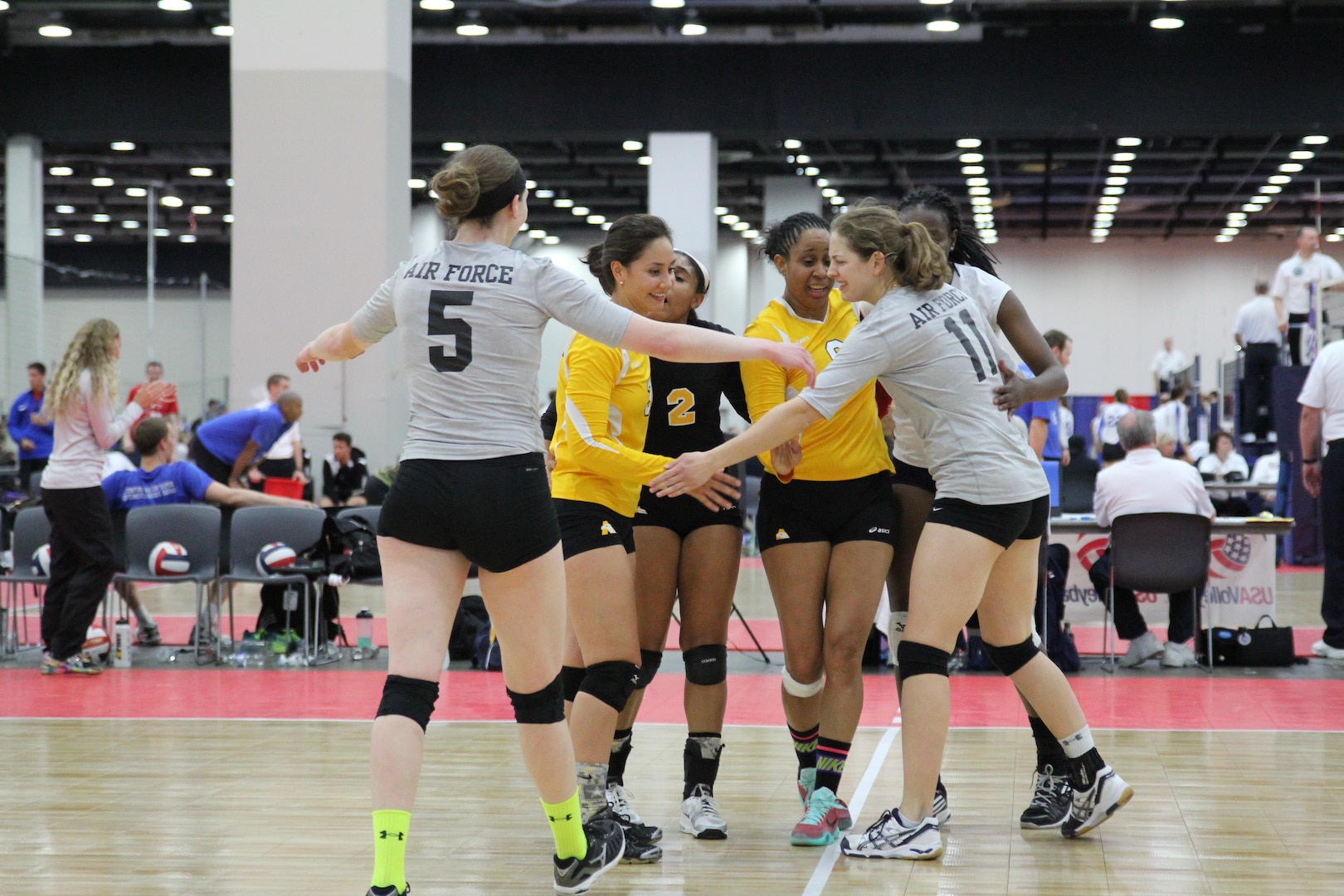 Members of the Army, Navy and Air Force women's volleyball team come together as an Armed Forces All-Star team as they faced Team Canada during friendly international Conseil International du Sport Militaire (CISM) exhibition match during the 2015 Armed Forces Volleyball Championship held in conjunction with the USA Volleyball National Championship at the COBO Center in Detroit, Mich. 22-24.  USA defeated Canada 2-1.