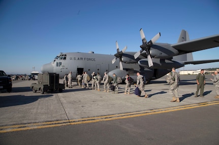 Service members from the Alaska National Guard and U.S. Army Alaska’s 3rd Battalion, 21st Infantry Regiment, board an Alaska Air National Guard, C-130 Hercules on Joint Base Elmendorf-Richardson bound for Ulaanbaatar, Mongolia, June 15. They will participate in Khaan Quest, a peacekeeping operations-focused, combined training event co-sponsored by the U.S. Army Pacific and U.S. Marine Corps Forces, Pacific, and hosted annually by the Mongolia Armed Forces.