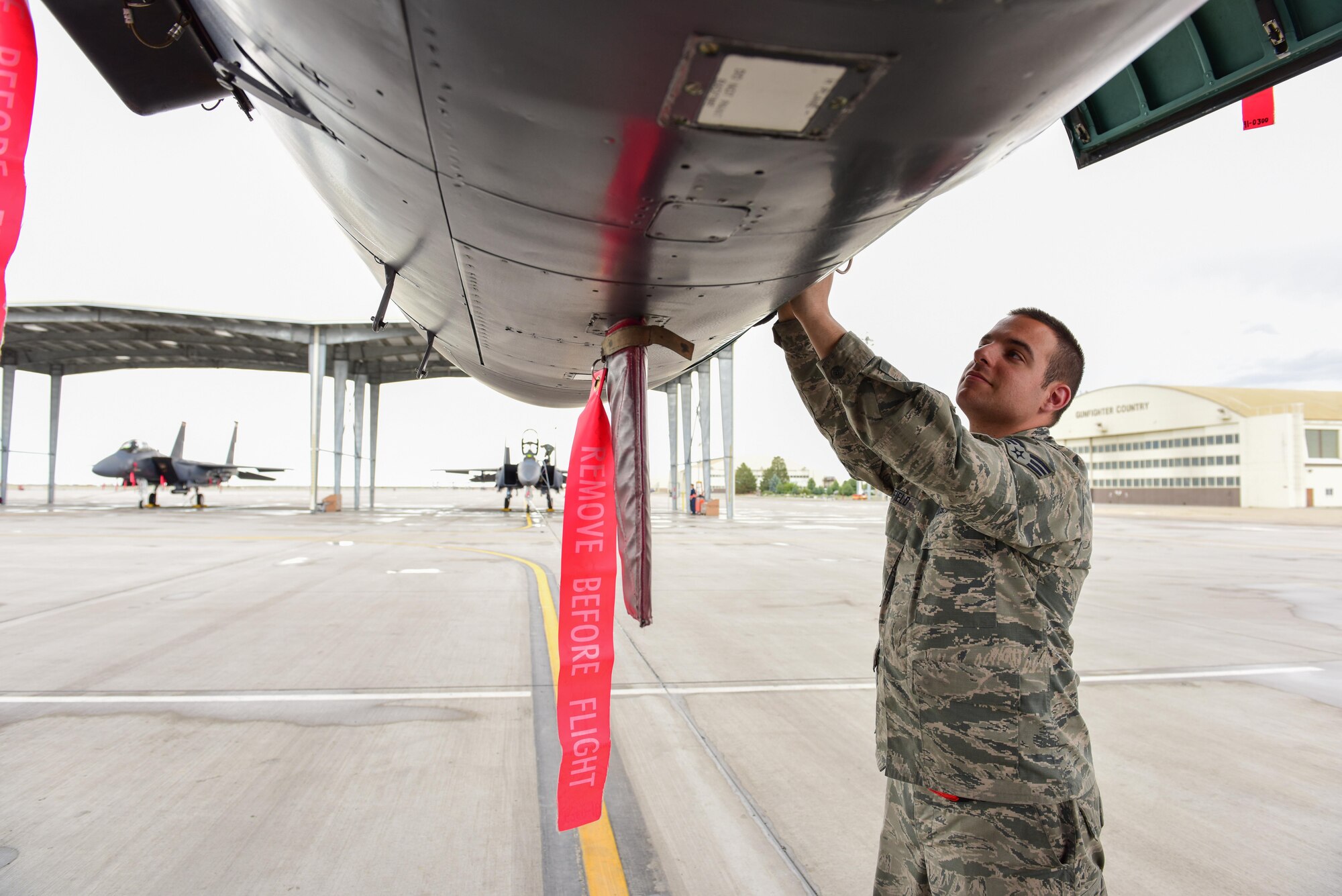 Senior Airman Austin Fifield, 414th Maintenance Squadron avionics system technician, inspects systems on an F-15E Strike Eagle on the flightline at Mountain Home Air Force Base, Idaho June 1. Fifield, temporarily assigned to the 391st Aircraft Maintenance Unit, is one of 10 reservists from Seymour Johnson Air Force Base, N.C., serving in an active duty capacity with the 366th Maintenance Group. (U.S. Air Force photo Staff Sgt. Lausanne Kinder)
