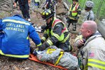 Emergency responders  prepare to transport a "victim" played by a member of the New York Army National Guard during a joint civilian-military emergency drill at the New York National Guard's Camp Smith Training Site near Peekskill, New York, June 13, 2015. Volunteer firefighters and area emergency medical responders joined New York Army National Guard Soldiers in an emergency response drill designed to test their ability to deal with an incident on the post.