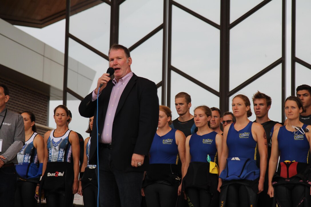 Chicago Blackhawks singer Jim Cornelison sings the national anthems of both the United States and Canada as the 2015 Armed Forces Triathlon Championship kicks off at Wolf Lake in Hammond, Ind. in conjunction with Leon's Triathlon on June 7th.