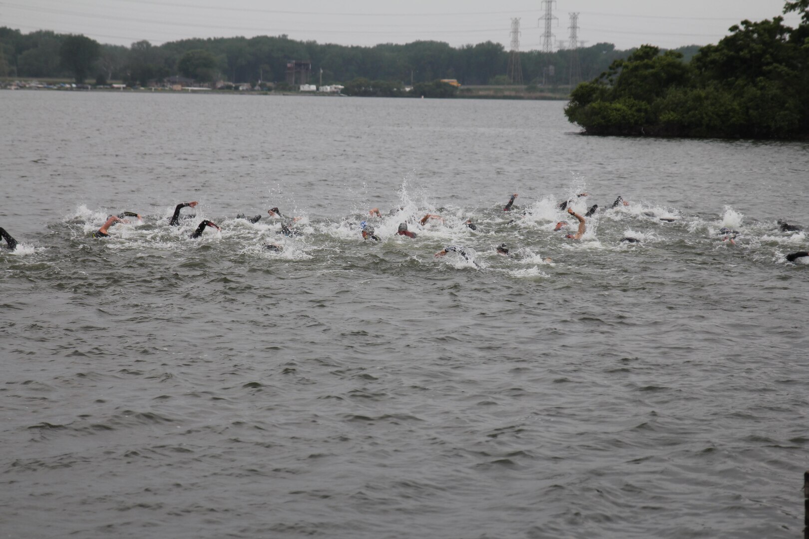 Start of the men's race of the 2015 Armed Forces Triathlon Championship at Wolf Lake in Hammond, Ind. held in conjunction with Leon's Triathlon on June 7, 2015.