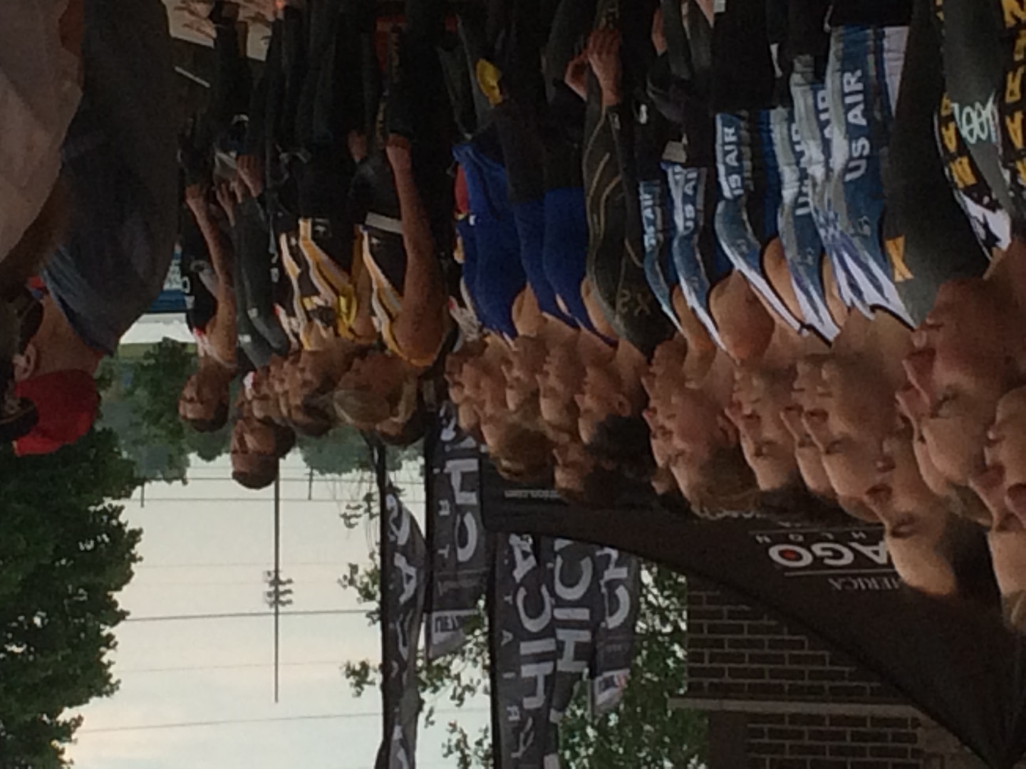 Service teams line up for the singing of the National Anthem during the 2015 Armed Forces Triathlon Championship held in conjunction with Leon's Triathlon in Hammond, Ind. on June 7.