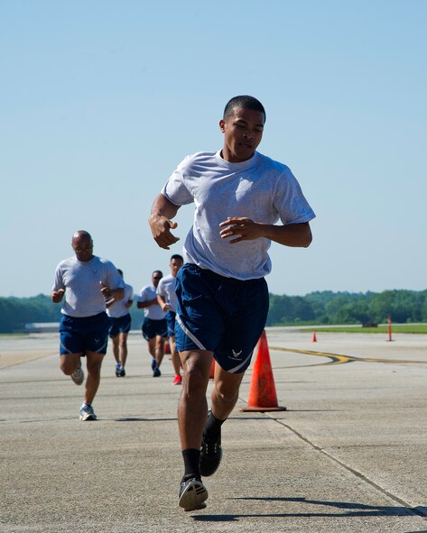 U.S. Air Force Airmen from the 38th Aerial Port Squadron and the 44th APS race against each other during the physical fitness section of the Port Dawg Challenge at Dobbins Air Reserve Base, Ga., June 17, 2015. The Port Dawg Challenge was created to enhance and maintain the camaraderie, esprit de corps and prestige of aerial port Airmen while promoting professionalism, leadership, training and communication between "Port Dawgs." (U.S. Air Force photo by Senior Airman Josh Slavin/Released)