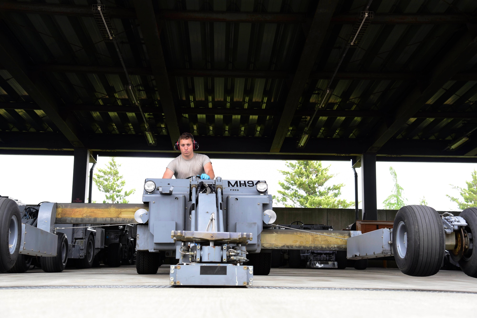 U.S. Air Force Senior Airman Wladimir Sierra, 35th Maintenance Squadron aerospace ground equipment journeyman, operates a MHU 83D/E lift truck at Misawa Air Base, Japan, June 17, 2015. Lift trucks are used to lift and attach munitions, weapons and other equipment weighing up to 7,000 pounds onto aircraft. (U.S. Air Force photo by Airman 1st Class Jordyn Fetter/Released)