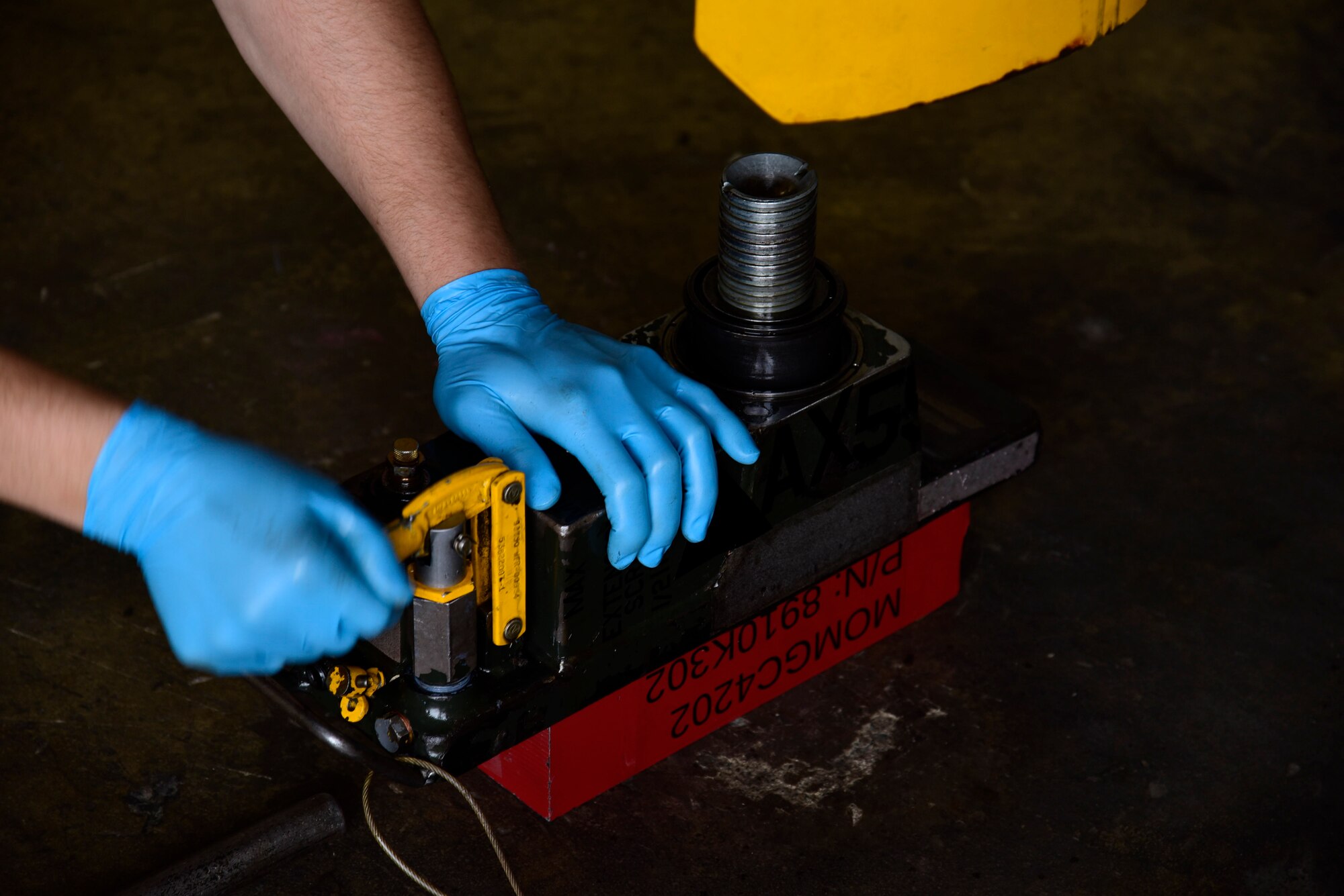 U.S. Air Force Senior Airman Wladimir Sierra, 35th Maintenance Squadron aerospace ground equipment journeyman, load tests a jack at Misawa Air Base, Japan, June 17, 2015. Load tests are performed as regular maintenance to ensure jacks can hold their expected weight limit and are fixed or replaced if the minimum weight isn’t reached.  (U.S. Air Force photo by Airman 1st Class Jordyn Fetter/Released)