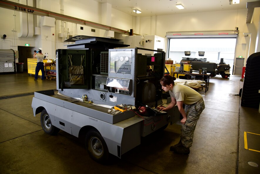 U.S. Air Force Staff Sgt. Megan Juhnke, 35th Maintenance Squadron aerospace ground equipment craftsman, performs maintenance on a generator at Misawa Air Base, Japan, June 17, 2015. In addition to moving equipment to areas of the flightline, AGE Airmen also inspect, troubleshoot and repair equipment like hydraulic test stands, air compressors and generator sets. (U.S. Air Force photo by Airman 1st Class Jordyn Fetter/Released)