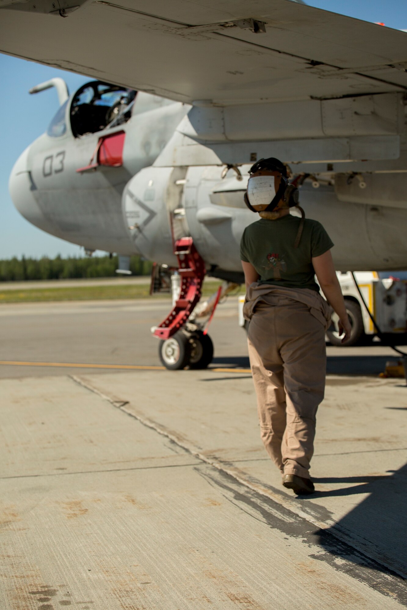 Lance Cpl. Jessica Kerr, from St. Louis, Missouri, inspects an EA-6B Prowler during Exercise Northern Edge 2015 June 15 at Eielson Air Force Base, Alaska. The Prowler is an electronic warfare aircraft used to jam radar signals making other military aircraft invisible to radar. NE15 is Alaska’s premier joint training exercise designed to practice operations, techniques and procedures as well as enhance interoperability among the services. Thousands of participants from all of the services airmen, soldiers, sailors Marines and Coast Guardsmen from active duty, reserve and National Guard Units are involved. Kerr is a plane captain with Marine Tactical Electronic Warfare Squadron 2, Marine Aircraft Group 14, 2nd Marine Aircraft Wing, II Marine Expeditionary Force. (U.S. Marine Corps Photo by Cpl. Thor J. Larson/Released)