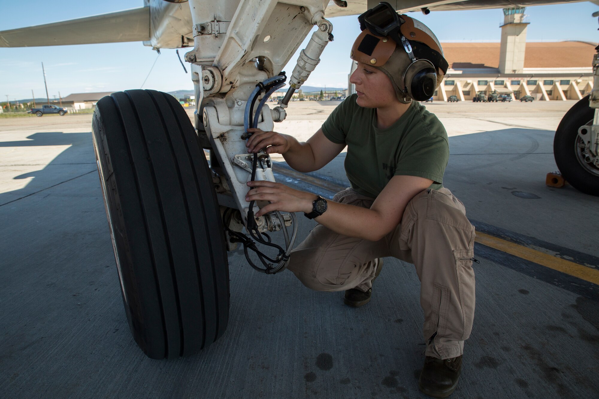 Lance Cpl. Jessica Kerr, from St. Louis, Missouri, inspects an EA-6B Prowler during Exercise Northern Edge 2015 June 15 at Eielson Air Force Base, Alaska. The Prowler is an electronic warfare aircraft used to jam radar signals making other military aircraft invisible to radar. Northern Edge 2015 is Alaska’s premier joint training exercise designed to practice operations, techniques and procedures as well as enhance interoperability among the services. Thousands of participants from all of the services, airmen, soldiers, sailors Marines and Coast Guardsmen from active duty, reserve and National Guard Units are involved. Kerr is a plane captain with Marine Tactical Electronic Warfare Squadron 2, Marine Aircraft Group 14, 2nd Marine Aircraft Wing, II Marine Expeditionary Force. (U.S. Marine Corps Photo by Cpl. Thor J. Larson/Released)