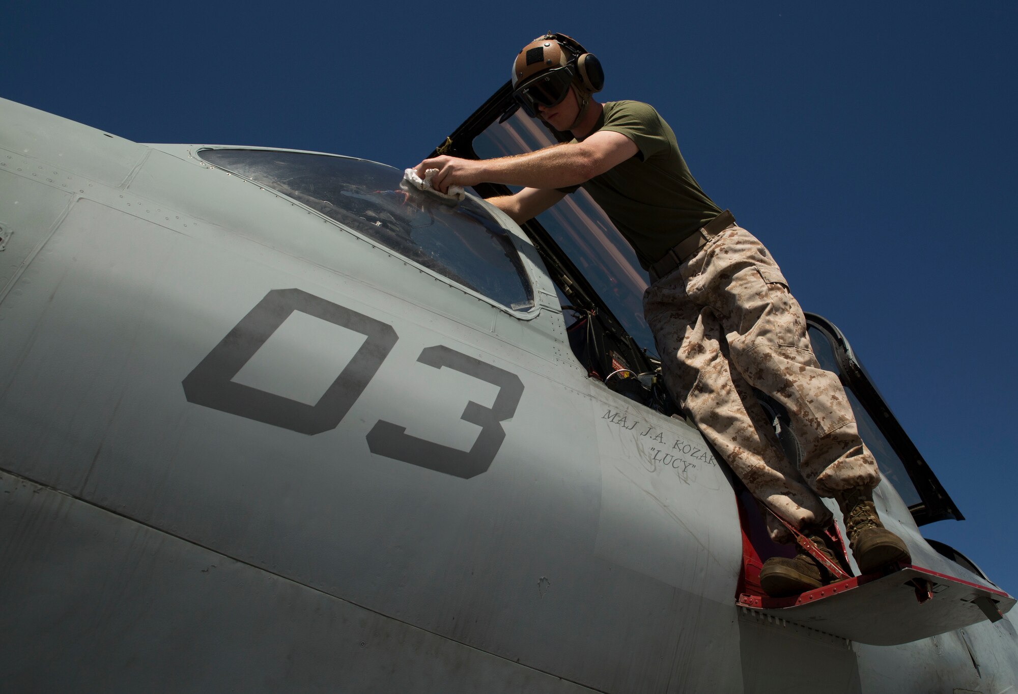 Lance Cpl. Gerrit B. Gribble, from Phoenix, Arizona, cleans the cockpit of an EA-6B Prowler during an inspection as part of Northern Edge 2015, June 15 at Eielson Air Force Base, Alaska. The Prowler is an electronic warfare aircraft used to jam radar signals making other military aircraft invisible to radar. NE15 is Alaska’s premier joint training exercise designed to practice operations, techniques and procedures as well as enhance interoperability among the services. Thousands of participants from all of the services, airmen, soldiers, sailors Marines and Coast Guardsmen from active duty, reserve and National Guard Units are involved. Gribble is an aircraft mechanic with Marine Tactical Electronic Warfare Squadron 2, Marine Aircraft Group 14, 2nd Marine Aircraft Wing, II Marine Expeditionary Force. (U.S. Marine Corps Photo by Cpl. Thor J. Larson/Released)