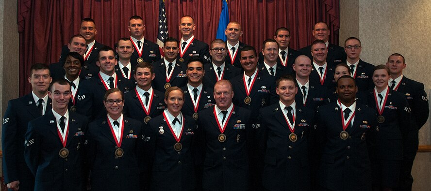 The Airmen Leadership School class 15-F poses for a photo before their graduation ceremony June 17, 2015, in the Trail’s End Event Center, F.E. Warren Air Force Base, Wyo. ALS is a six week course designed to prepare Airmen to assume supervisory duties as well as instruction in the practice of leadership and followership. Enlisted Airmen must graduate ALS before supervising other Airmen. (U.S. Air Force photo by Airman 1st Class Brandon Valle)