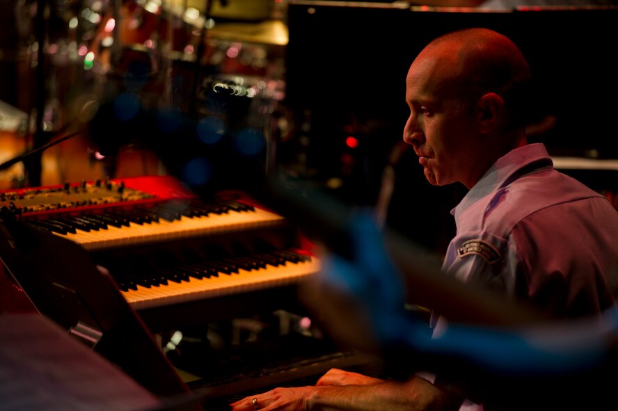 Tech Sgt. Marshall Gentry, a Fresno, California native, plays keyboard for U.S. Air Force Heartland of America Band Vortex in Nelson Hall Auditorium at Minot State University, Minot, N.D., June 16, 2015. Vortex fosters public support with free performances, aides recruiting initiatives and is world-wide deployable. (U.S. Air Force photo/Airman 1st Class Justin T. Armstrong)