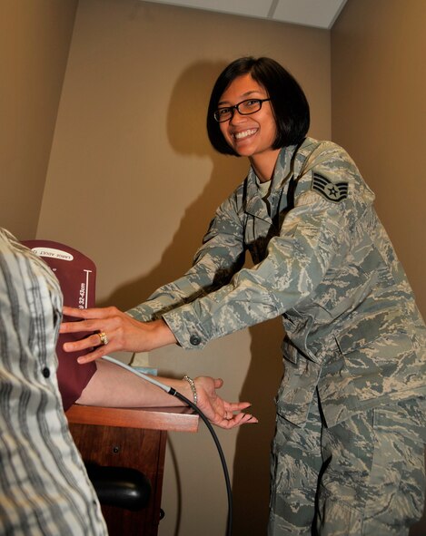Staff Sgt. Michelle Malinao, 92nd Medical Operations Squadron mental health technician, takes a patient’s blood pressure June 18, 2015, at Fairchild Air Force Base, Wash. Malinao oversees the mental health element, schedules patient appointments and ensures all patients are getting the best possible treatment from the clinic and flight, her leadership selected her as one of Fairchild’s Finest, a weekly recognition program that highlights top-performing Airmen. (U.S. Air Force photo/Airman 1st Class Taylor Bourgeous) 
