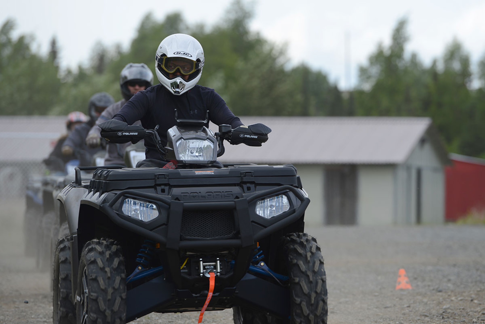 A row of students enter the all-terrain vehicle riding course during an ATV course at the Hillberg Ski Resort on JBER June 10. The JBER Outdoor Recreation Center offers an ATV course to first-time and seasonal riders to earn their JBER ATV license in a four-hour class. (U.S. Air Force photo/Airman Christopher R. Morales)