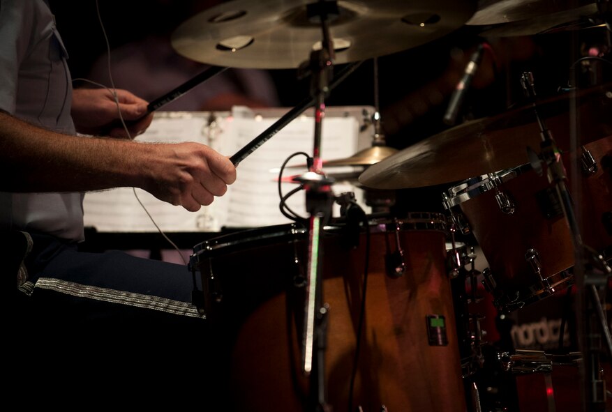 Tech. Sgt. Jarrett Robinett, U.S. Air Force Heartland of America Band Vortex percussionist, performs with his band in Nelson Hall, at Minot State University, Minot N.D., June 16, 2015. In addition to the concert at MSU, the band also offered free concerts in surrounding communities to thank community members throughout the missile complex for their support of the mission at Minot Air Force Base. (U.S. Air Force photo/Senior Airman Stephanie Morris)