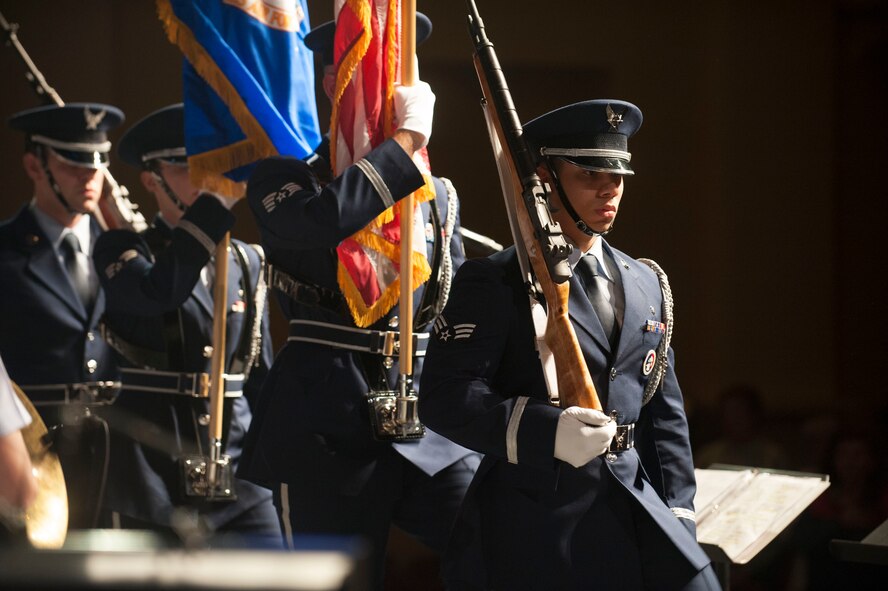 Members of the Minot Air Force Base honor guard present the colors during the U.S. Air Force Heartland of America Band Vortex concert in Nelson Hall, at Minot State University, Minot N.D., June 16, 2015. Hailing from United States Strategic Command, 55th Wing, 557th Weather Wing and other tenant units at Offutt AFB, Nebraska, Vortex is dedicated to providing innovative, professional musical support for events that enhance military morale and esprit de corps. (U.S. Air Force photo/Senior Airman Stephanie Morris)