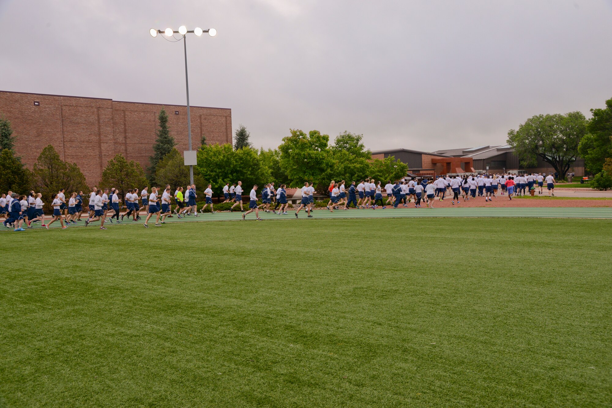 PETERSON AIR FORCE BASE, Colo. - 21st Space Wing Airmen begin the monthly Wing Warfit 5K by the Base Gym June 16. Airmen from groups across base showed up to participate despite the damp weather. (U.S. Air Force photo by Tech. Sgt. Jared Marquis)