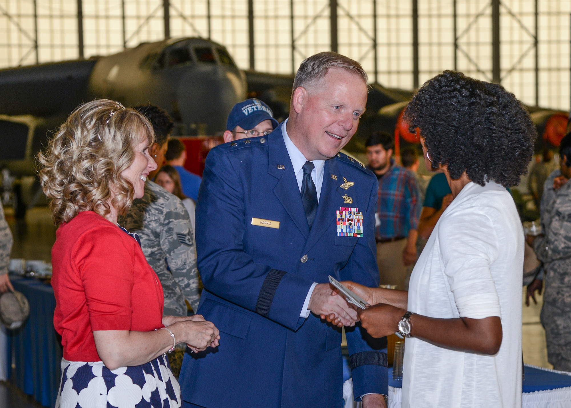 Maj. Gen. David A. Harris, Air Force Test Center commander, and his wife Valene, shake hands with the members of Team Edwards. (U.S. Air Force photo by Rebecca Amber)