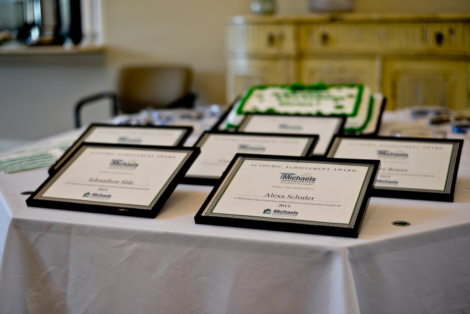 Scholarship awards lay on a table at MacDill Air Force Base, Fla., June 17, 2015. Six military dependents from Team MacDill received a grant, ranging from $1,000 to $4,000, to apply towards continuous education. (U.S. Air Force photo by Senior Airman Melanie Bulow-Gonterman/Released)