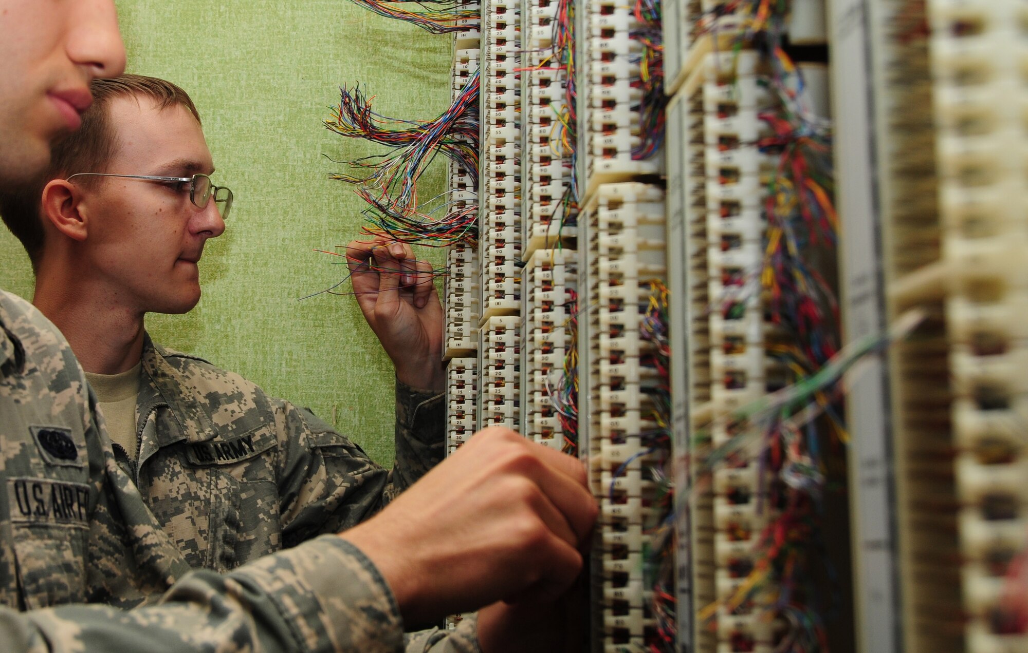 118th Communications Squadron Airman and 230th Signal Company soldier train in a 
joint exercise June 16, 2015.  (Air National Guard photo by Master Sergeant Jeremy Cornelius/ Released)

