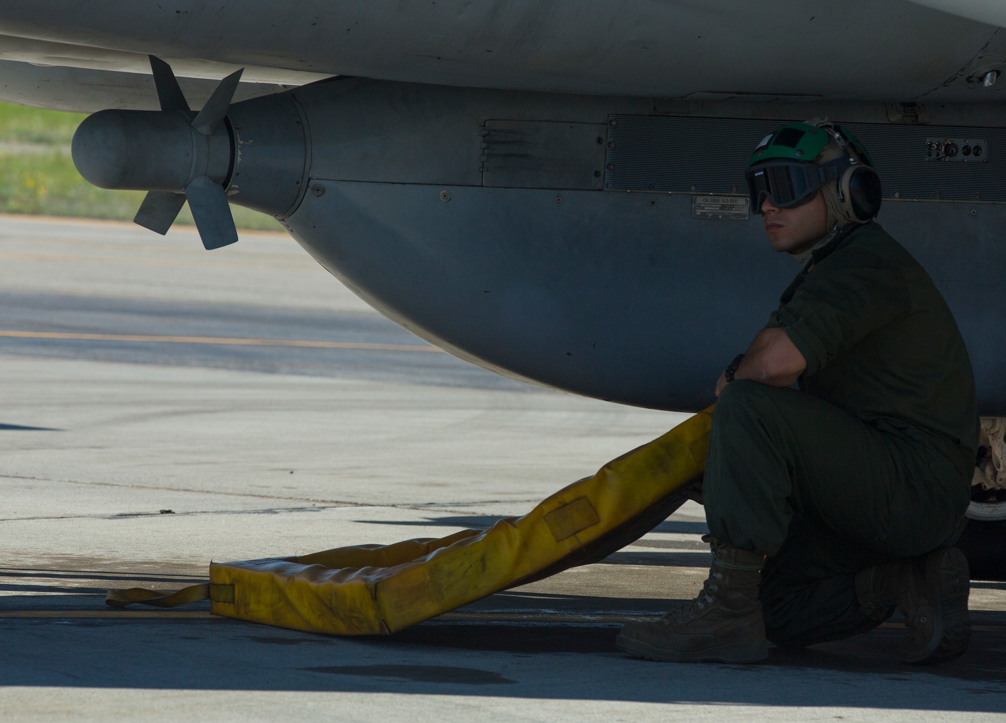 U.S. Marine Corps Cpl. Nestor Vega, an electronic counter measure with Marine Tactical Electronic Warfare Squadron (VMAQ) 2, 2nd Marine Aircraft Wing, works underneath a Marine Corps EA-6B Prowler assigned to VMAQ-2 while performing routine maintenance on the aircraft during Exercise Northern Edge 15 at Eielson Air Force Base, Alaska, June 15, 2015. Northern Edge is Alaska’s premier joint training exercise designed to practice operations, techniques and procedures as well as enhance interoperability among the services. Thousands of participants from all services, Airmen, Soldiers, Sailors, Marines and Coast Guardsmen from active duty, Reserve and National Guard units are involved. (U.S. Marine Corps photo by Cpl. Suzanne Dickson/Released)