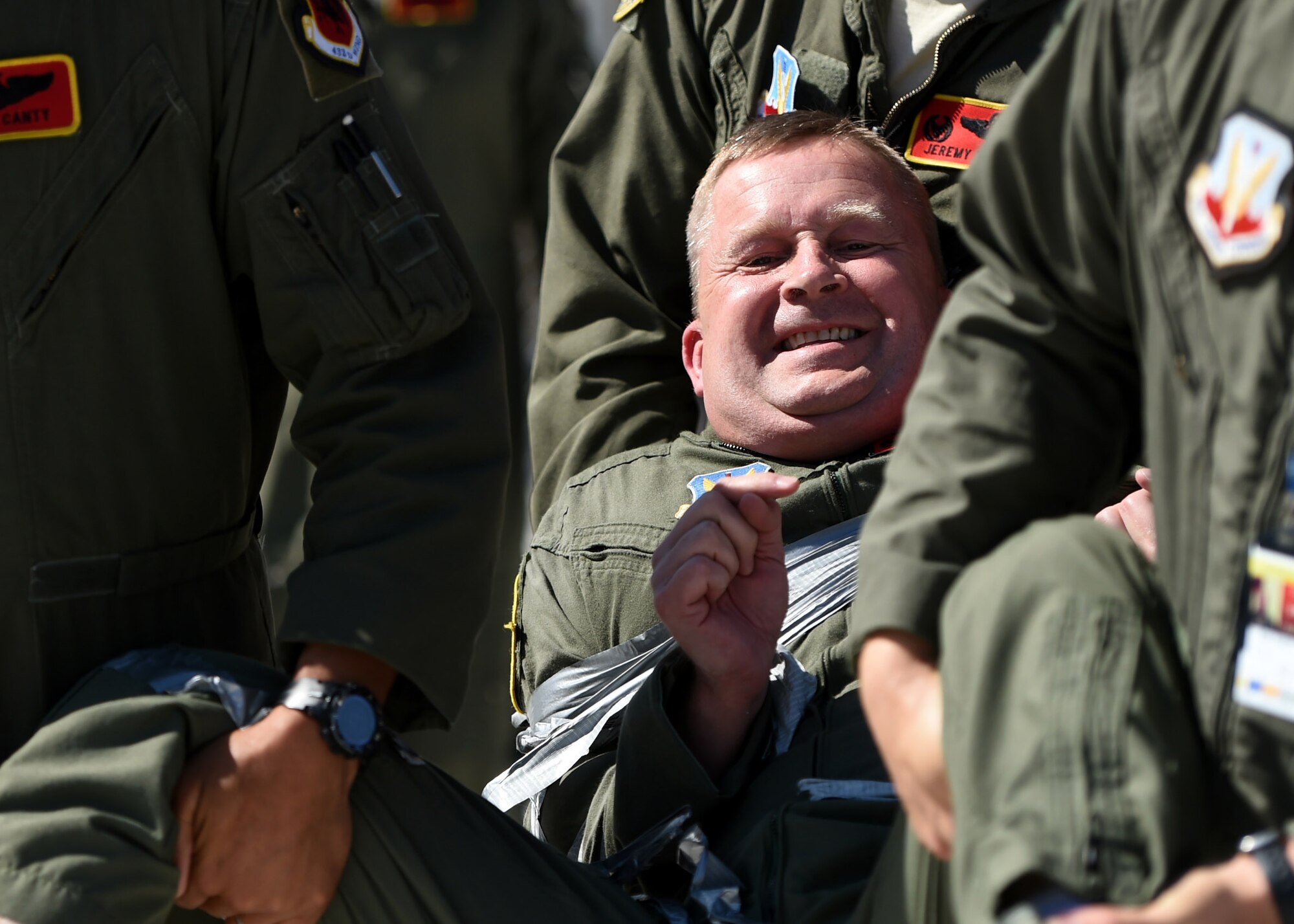 Col. James Cluff, 432nd Wing/432nd Air Expeditionary Wing commander, is carried out of the training area after his fini flight May 28th, 2015 on Creech Air Force Base Neva. The wing passed the 2 million flying hour milestone Oct. 22, 2013 under Col. Cluff’s command. (U.S. Air Force photo by Tech. Sgt. Nadine Barclay/RELEASED) 