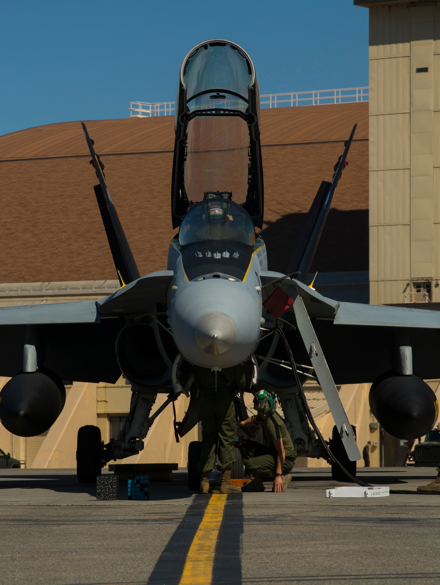 U.S. Marines with Marine All-Weather Fighter Attack Squadron (VMFA [AW]) 242, 1st Marine Aircraft Wing conduct routine maintenance on a Marine Corps FA-18D Hornet assigned to VMFA (AW)-242 during Exercise Northern Edge 15 at Eielson Air Force Base, Alaska, June 15, 2015. Northern Edge is Alaska’s premier joint training exercise designed to practice operations, techniques and procedures as well as enhance interoperability among the services. Thousands of participants from all services, Airmen, Soldiers, Sailors, Marines and Coast Guardsmen from active duty, Reserve and National Guard units are involved. (U.S. Marine Corps photo by Cpl. Suzanne Dickson/Released)