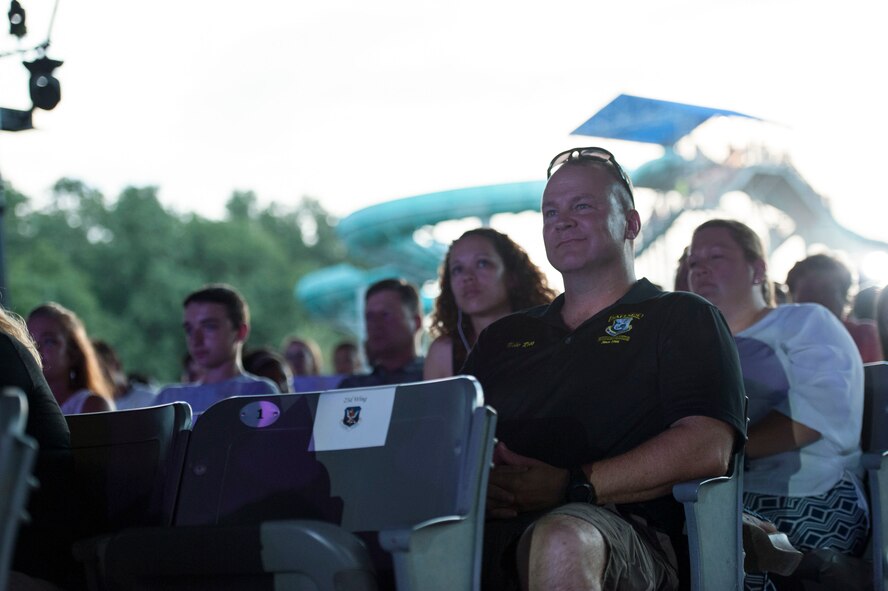 U.S. Air Force Col. Mike Ross, 820th Base Defense Group commander, watches a Tops in Blue performance June 12, 2015, at Wild Adventures in Valdosta, Ga. During the Tops in Blue 90-minute performance, several Team Moody Airmen were recognized for their superior performance during a the show’s heroes welcome.  (U.S. Air Force photo by Andrea Jenkins/Released)


