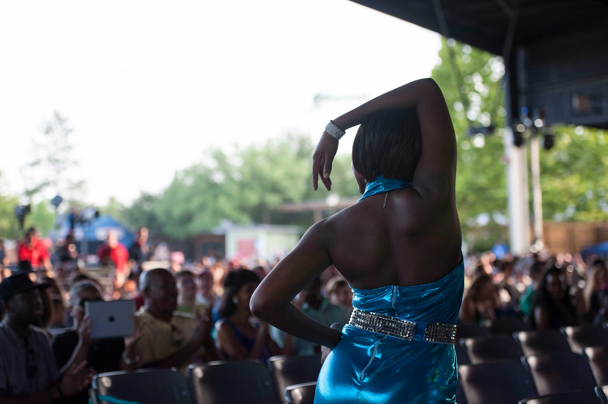 U.S. Air Force Staff Sgt. Sherita Tisdom, Tops in Blue performer, dances in the crowd during a performance June 12, 2015, at Wild Adventures in Valdosta, Ga. Tisdom, an Atlanta native, is a Health Services Management journeyman at Maxwell Gunter Air Force Base, Ala. (U.S. Air Force photo by Andrea Jenkins/Released)
