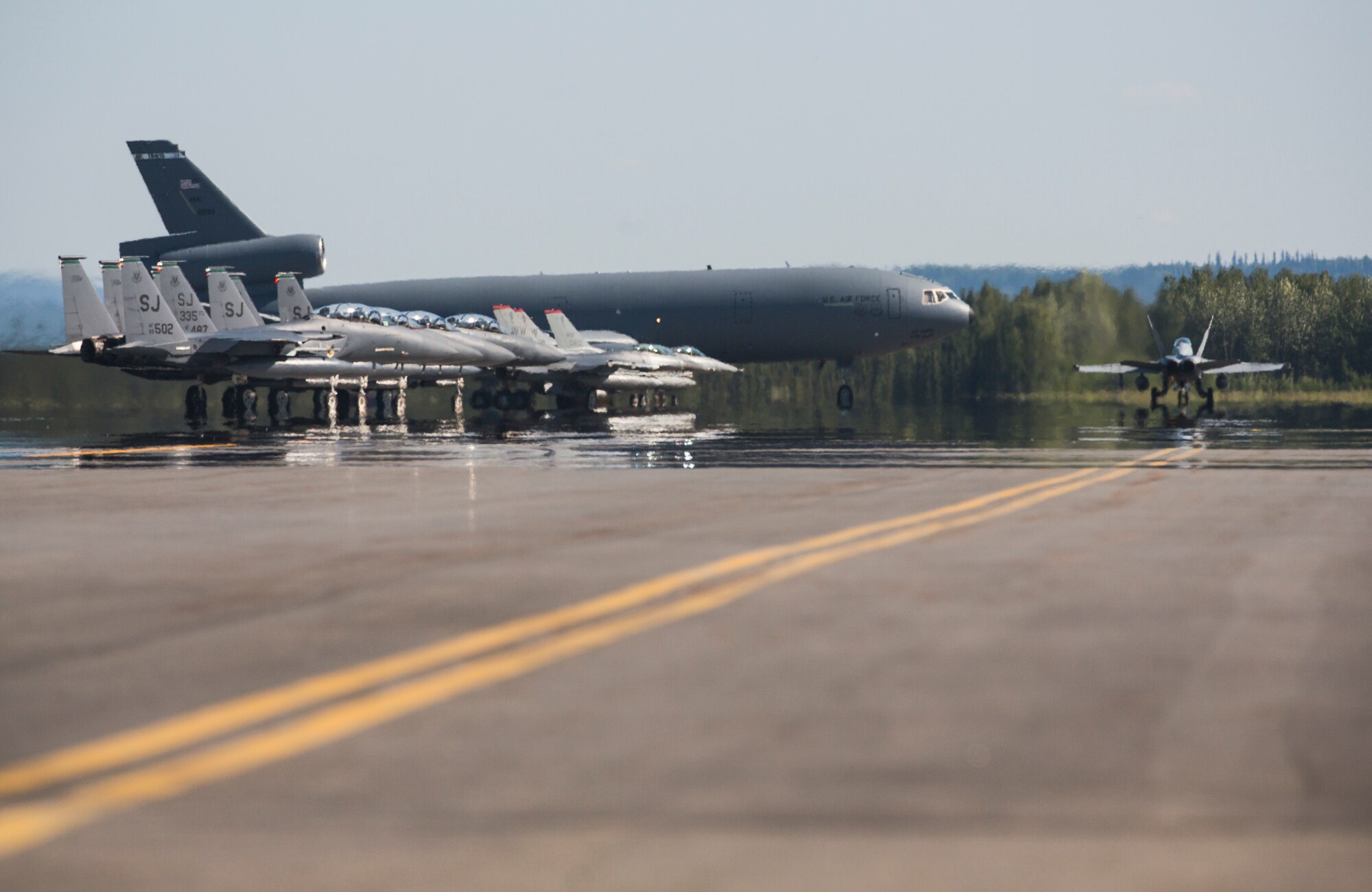 Various U.S. Marine Corps and U.S. Air Force aircraft prepare to take off June 15, 2015, during Exercise Northern Edge 15 at Eielson Air Force Base, Alaska. Northern Edge 15 is Alaska’s premier joint training exercise designed to practice operations, techniques and procedures as well as enhance interoperability among the services. Thousands of participants from all the services, Airmen, Soldiers, Sailors, Marines and Coast Guardsmen from active duty, Reserve and National Guard units are involved. (U.S. Marine Corps photo by Staff Sgt. Jeffrey D. Anderson/ Released)