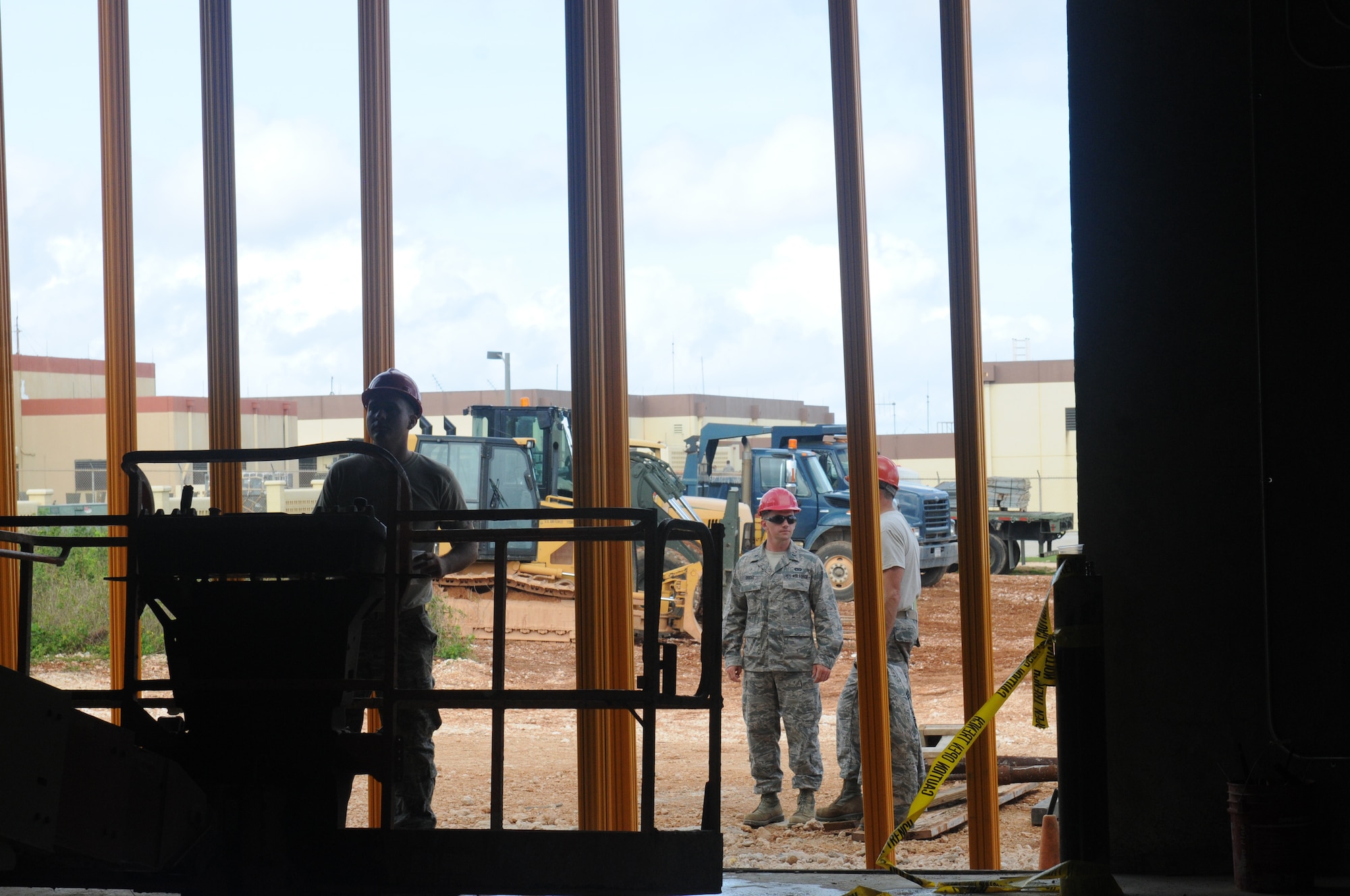 Airmen from the Virginia Air National Guard’s Virginia Beach-based 203rd RED HORSE Squadron and the 202nd RHS from Camp Blanding, Florida refine and train upon essential skills June 7, 2015 during a joint training mission to construct a Facilities Systems Training facility at Anderson Air Force Base, Guam. The Airmen are conducting training while building the FST facility under the Air National Guard’s Deployment for Training program. (U.S. Air National Guard photo by Tech. Sgt. Meghan Skrepenski/Released)