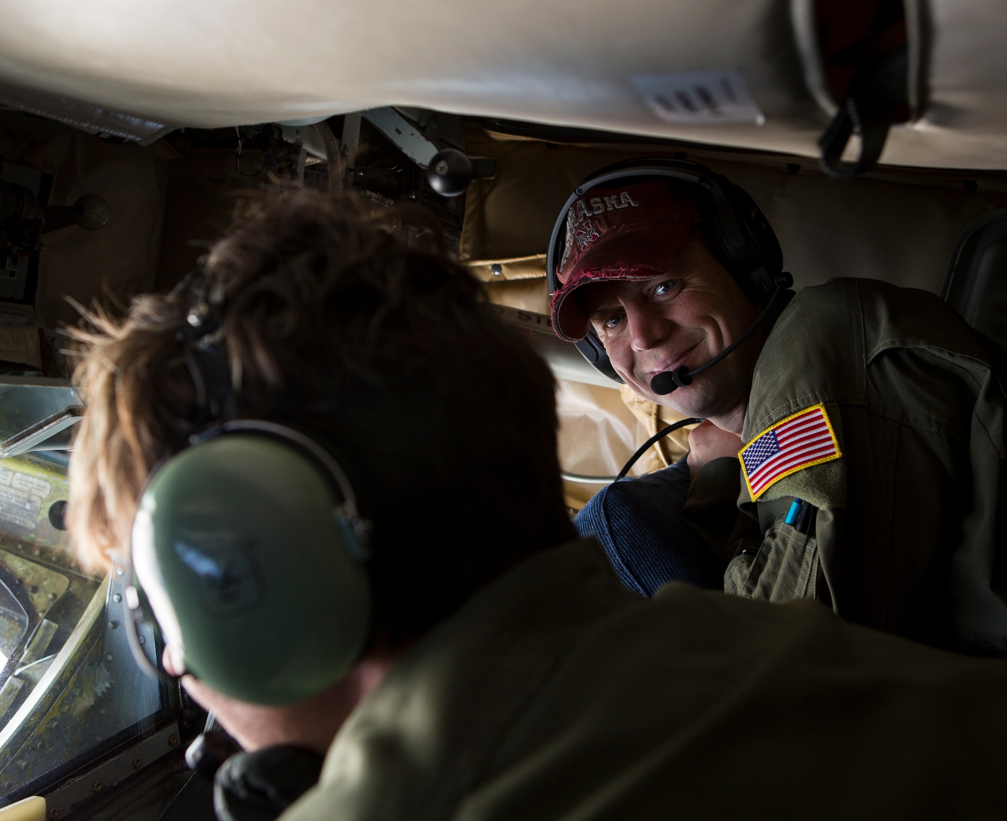 U.S. Air Force Tech. Sgt. Jason P. Wesche, right, boom operator, Air Force Reserve Command, smiles while conducting a pre-flight inspection of the of boom pod inside a KC-135T Stratotanker prior to a training mission during Exercise Northern Edge 15 at Eielson Air Force Base, Alaska, June 16, 2015. Northern Edge is Alaska’s premier joint training exercise designed to practice operations, techniques and procedures as well as enhance interoperability among the services. Thousands of Service members from active duty, Reserve and National Guard units are involved. (U.S. Marine Corps photo by Cpl. Suzanne Dickson/ Released)