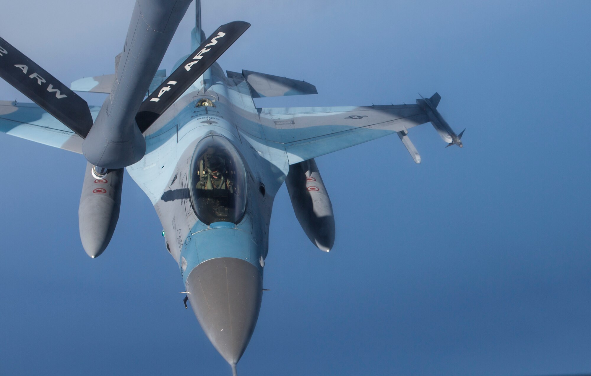 A U.S. Air Force F-16 Fighting Falcon assigned to the 354th Fighter Wing, Eielson Air Force Base, Alaska, aligns under the boom of a U.S. Air Force KC-135T Stratotanker assigned to the 92nd Air Refueling Wing, Fairchild Air Force Base, Wash., June 16, 2015, while conducting a training mission over the Gulf of Alaska during Exercise Northern Edge 15. Northern Edge is Alaska’s premier joint training exercise designed to practice operations, techniques and procedures as well as enhance interoperability among the services. Thousands of service members from active duty, Reserve and National Guard units are involved. (U.S. Marine Corps photo by Cpl. Suzanne Dickson/ Released)