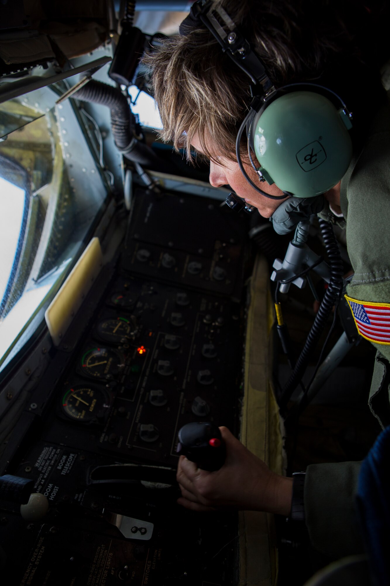 U.S. Air Force Tech. Sgt. Erica J. Knight, boom operator, Air Force Reserve Command, controls the refueling boom of a U.S. Air Force KC-135T Stratotanker assigned to the 92nd Air Refueling Wing, Fairchild Air Force Base, Wash., June 16, 2015, while conducting a training mission over the Joint Pacific Alaska Range Complex during Exercise Northern Edge 15. Northern Edge is Alaska’s premier joint training exercise designed to practice operations, techniques and procedures as well as enhance interoperability among the services. Thousands of service members from active duty, Reserve and National Guard units are involved. (U.S. Marine Corps photo by Cpl. Suzanne Dickson/ Released)
