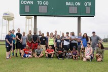 Team members, spectators and volunteers pose for a photo on Laughlin Air Force Base, Texas, June 13, 2015. More than 40 people worked to make Laughlin’s first ever Dorm Olympics possible. The Dorm Olympics consisted of swimming events, a relay race, 100 meter hurdles, a wheelbarrow race, and other strenuous events. (U.S. Air Force photo by Airman 1st Class Brandon May)