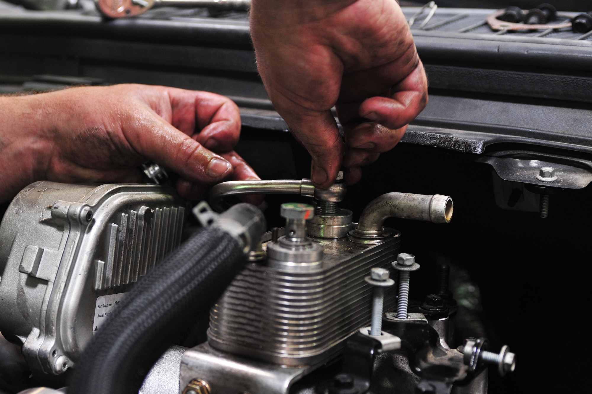 Staff Sgt. Kenneth Brown, 4th Logistics Readiness Squadron vehicle maintenance floor supervisor, secures a turbocharger in a Ford F-350 Bobtail truck, June 11, 2015, at Seymour Johnson Air Force Base, North Carolina. A turbocharger pressurizes the air flowing into an engine to help it operate more efficiently. (U.S. Air Force photo/Senior Airman John Nieves Camacho)