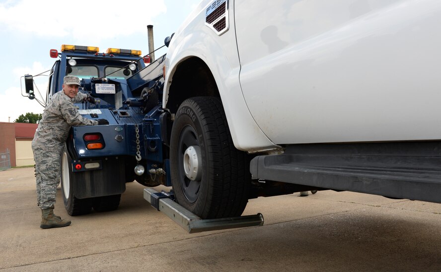 Tech. Sgt. James Baggott, 403rd Logistics Readiness Squadron vehicle control officer from Keesler Air Force Base, Miss., operates  power takeoff controls to lift a pickup truck with a 20-ton wrecker on Barksdale Air Force Base, La., June 12, 2015. Baggott was one of five reserve Airmen from Keesler to come to Barksdale for two weeks as part of an annual tour for training with the 2nd LRS vehicle operations Airmen. (U.S. Air Force photo/Airman 1st Class Curt Beach)