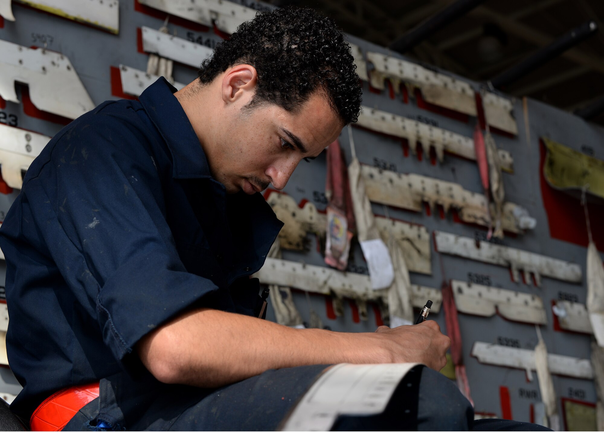 U.S. Air Force Airman 1st Class Nathaniel Lott, 31st Aircraft Maintenance Squadron phase technician, cleans and inspects panels removed during a phase inspection of an F-16 Fighting Falcon, June 15, 2015, at Aviano Air Base, Italy. Every panel is removed and inspected for damage. Phase inspections are conducted after an aircraft has flown 400 flying hours. (U.S. Air Force Airman 1st Class Cary Smith/Released)