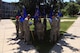 MCGHEE TYSON AIR NATIONAL GUARD BASE, Tenn. - Newly appointed flight guidon-carriers read about their duties in the shade of a pine tree on a hot afternoon here June 17, 2015, at the I.G. Brown Training and Education Center. The Senior Airmen just arrived on campus and began their two-week in-resident studies, as part of the Phase II portion of the Air National Guard's satellite Airman leadership school, Paul H. Lankford Enlisted PME Center.  (U.S. Air National Guard photo by Master Sgt. Mike R. Smith/Released)