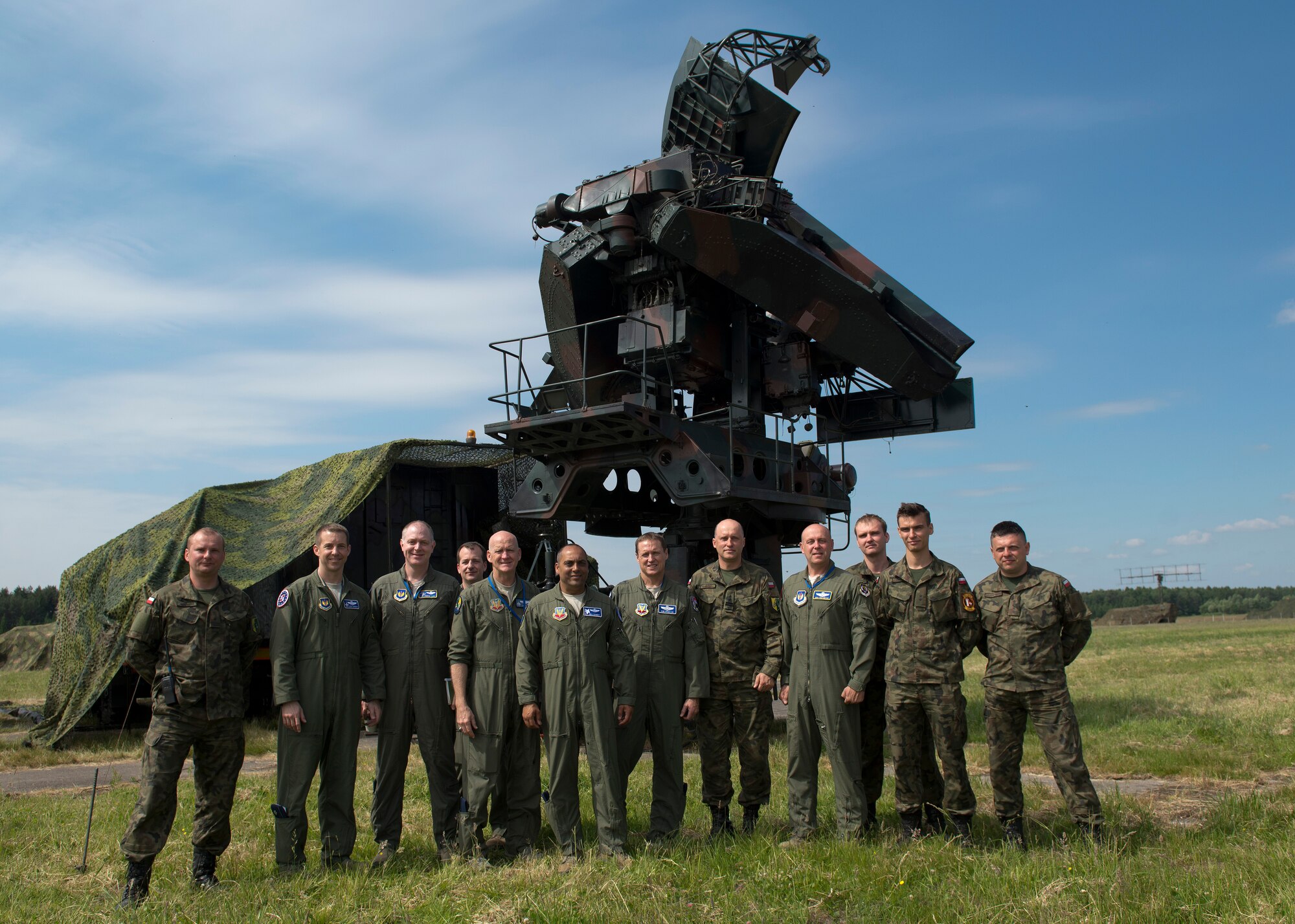 U.S. and Bulgarian Air Force Airmen stand for a photo in front of a SA-3 surface-to-air missile system at Łask Air Base, Poland, June 11, 2015. U.S. Airmen from the 480th Fighter Squadron, Spangdahlem AB, Germany, and 169th Fighter Wing, South Carolina Air National Guard, are deployed to the Łask AB in support of the F-16 Fighting Falcon aviation detachment rotation. The AVDET is an opportunity for total force Airmen to hone their skills in a forward location while participating in bi-lateral training with a key ally, Poland. (U.S. Air Force photo/Tech. Sgt. Paul Villanueva II)