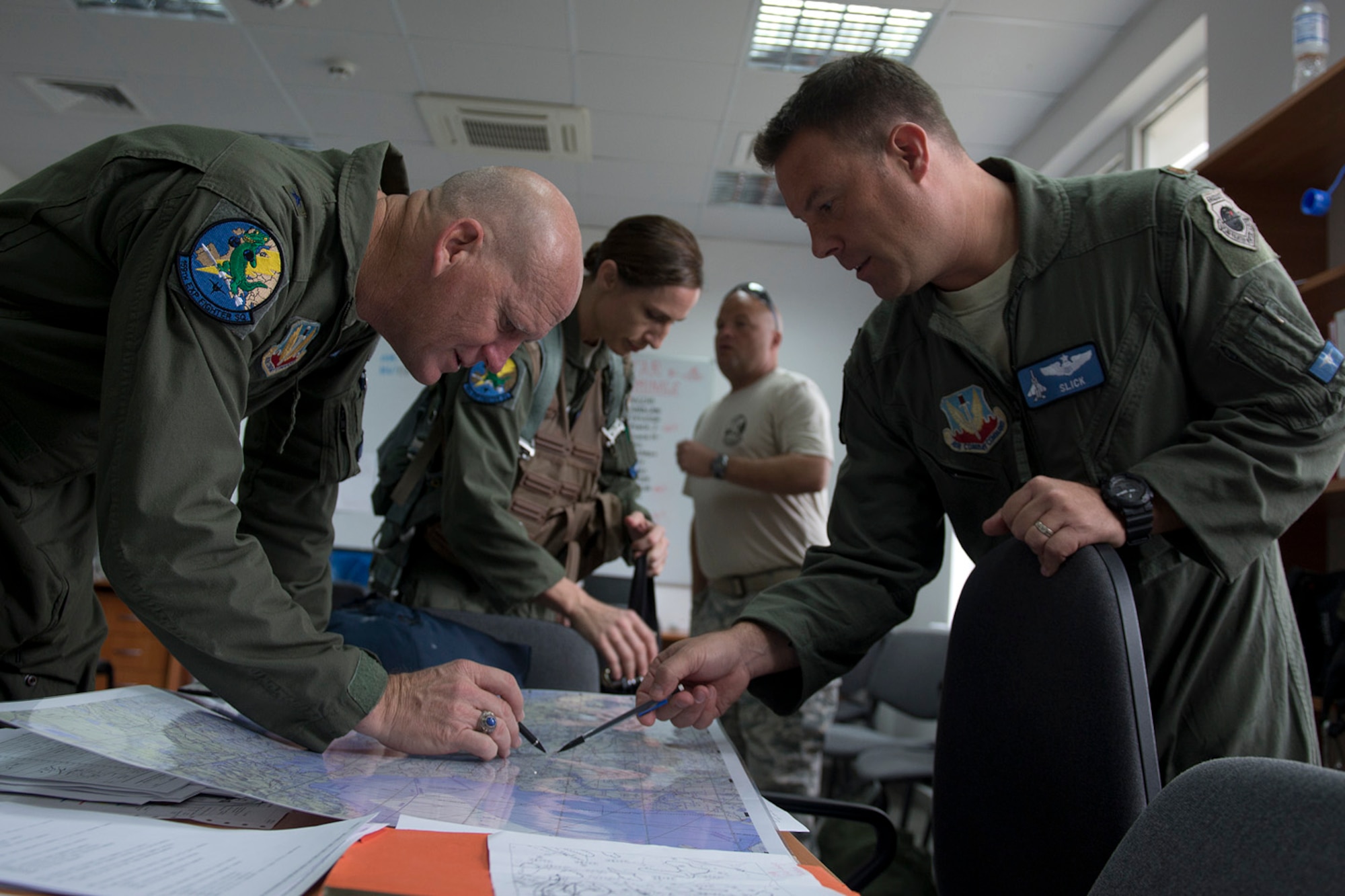U.S. Air Force Brig. Gen. James O. Eifert, left, gets a flight briefing from Maj. Kevin Winger at Graf Ignatievo Air Base, Bulgaria, June 9, 2015. Eifert, Florida Air National Guard assistant adjutant general, is on a site visit to meet with active duty and ANG Airmen deployed to the 159th Expeditionary Fighter Squadron in support of the theater security package. The combined efforts of the total force Airmen help maintain a global presence and strengthen relationships with NATO allies through various training scenarios. Winger is an F-15 Strike Eagle pilot with the 125th Fighter Wing, Florida ANG. (U.S. Air Force photo/Tech. Sgt. Paul Villanueva II)