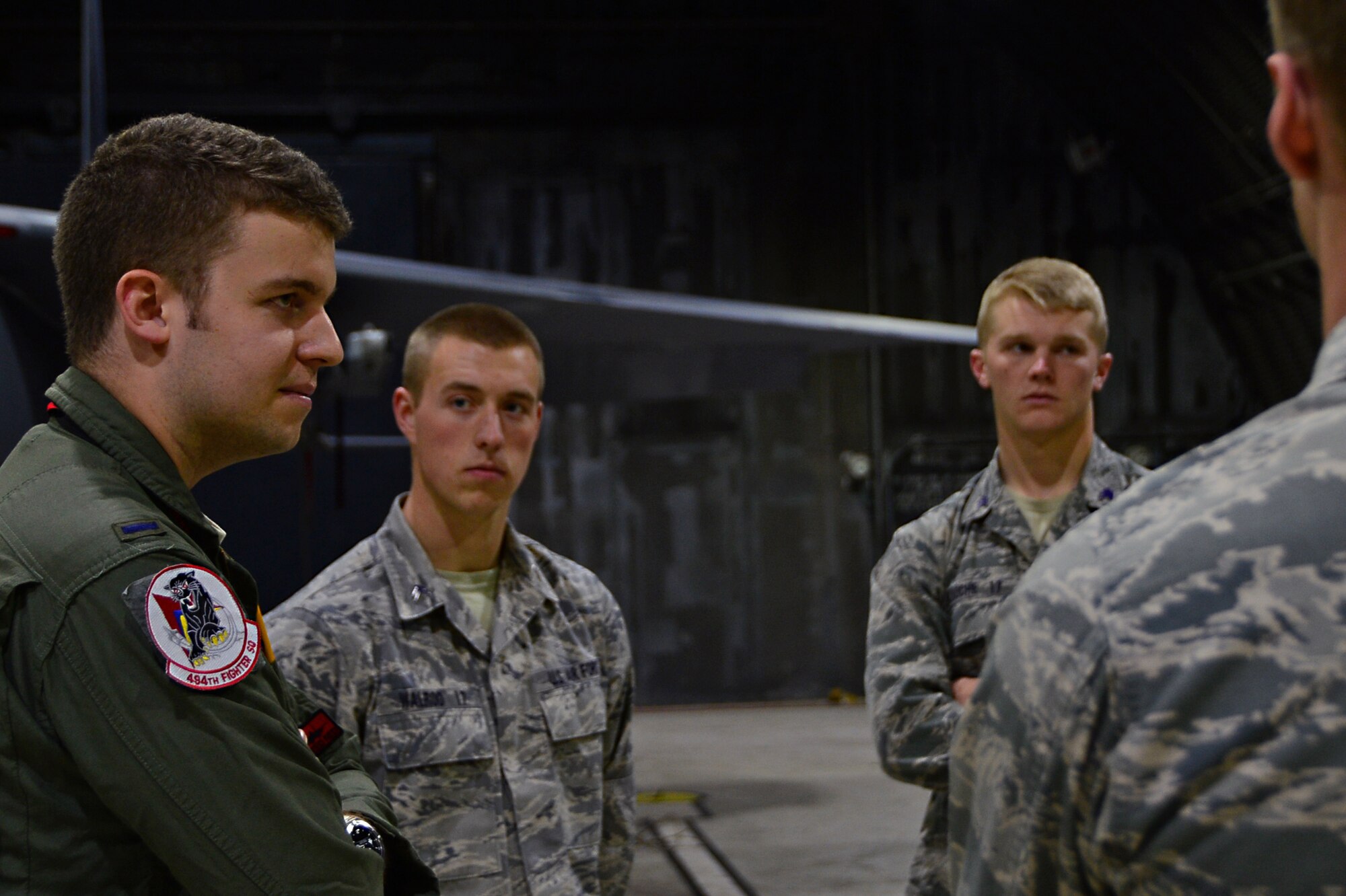 1st Lt. Paul Carpenter, 494th Fighter Squadron F-15E Strike Eagle pilot, speaks with U.S. Air Force Academy cadets during a tour at Royal Air Force Lakenheath, England, June 10, 2015. The cadets departed the academy in Colorado Springs, Co., to visit RAF’s Lakenheath and Mildenhall to learn how overseas bases operate and support the Air Force mission. (U.S. Air Force photo by Senior Airman Erin O’Shea/Released)