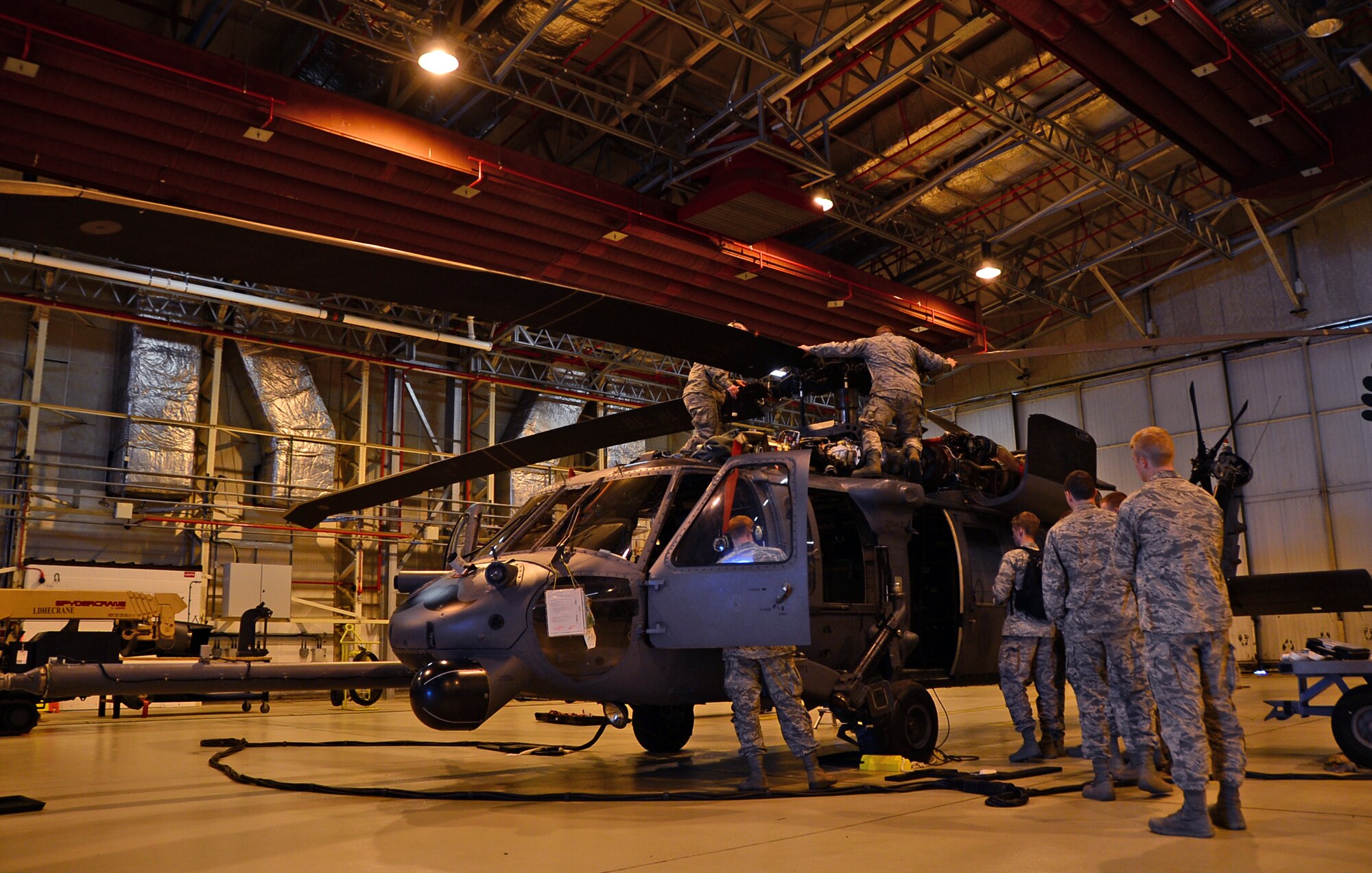 U.S. Air Force Academy cadets visit the 56th Rescue Squadron to acquire information about their operations and assets during a tour at Royal Air Force Lakenheath, England, June 10, 2015. The cadets visited RAF’s Lakenheath and Mildenhall to learn about each base’s mission capabilities and various unit responsibilities. (U.S. Air Force photo by Senior Airman Erin O’Shea/Released)