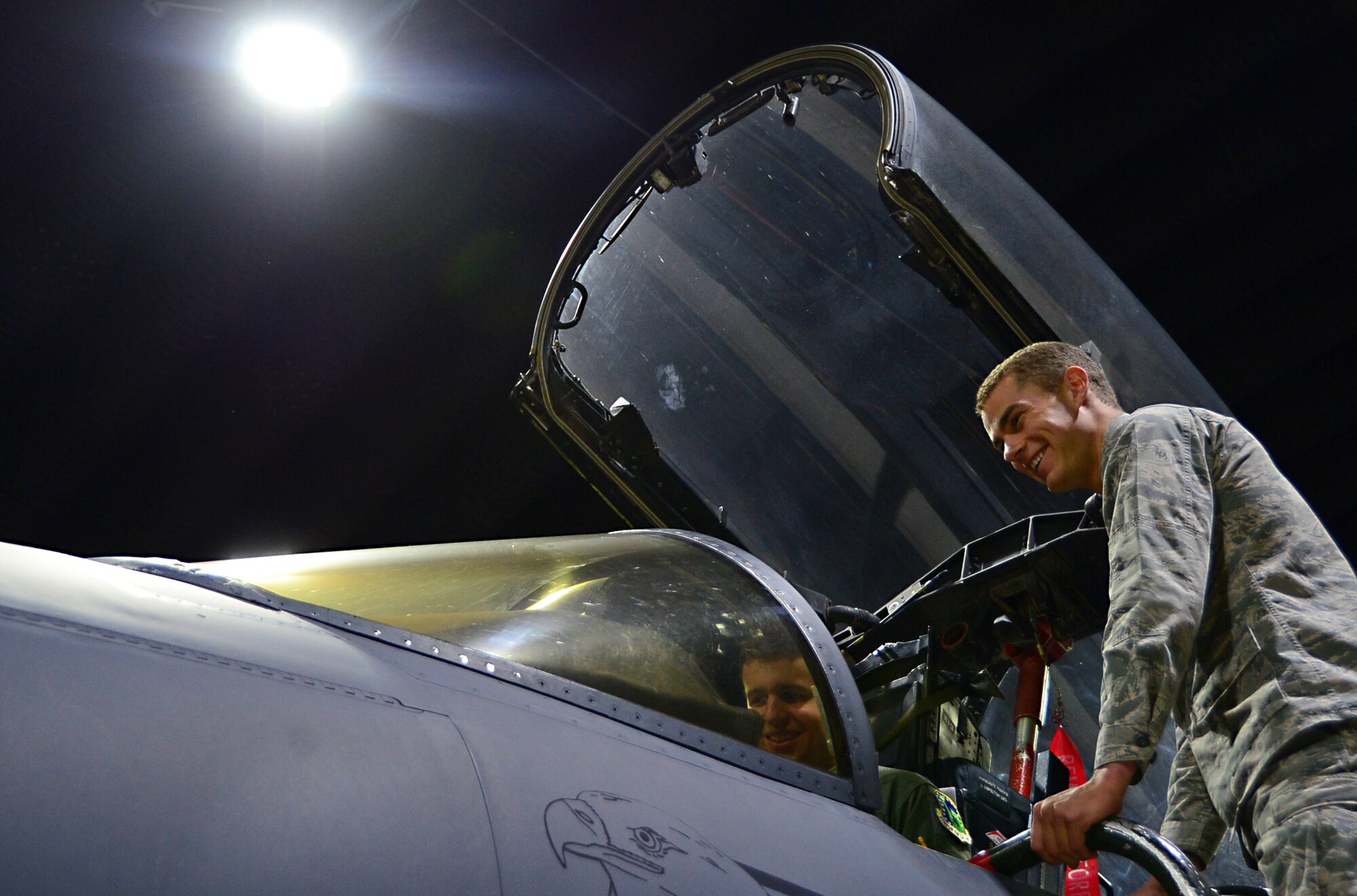A U.S. Air Force Academy cadet peers inside the cockpit of a 492nd Fighter Squadron F-15E Strike Eagle during a tour at Royal Air Force Lakenheath, England, June 10, 2015. The cadets visited RAF’s Lakenheath and Mildenhall to learn about each base’s mission capabilities and various unit responsibilities. (U.S. Air Force photo by Senior Airman Erin O’Shea/Released)