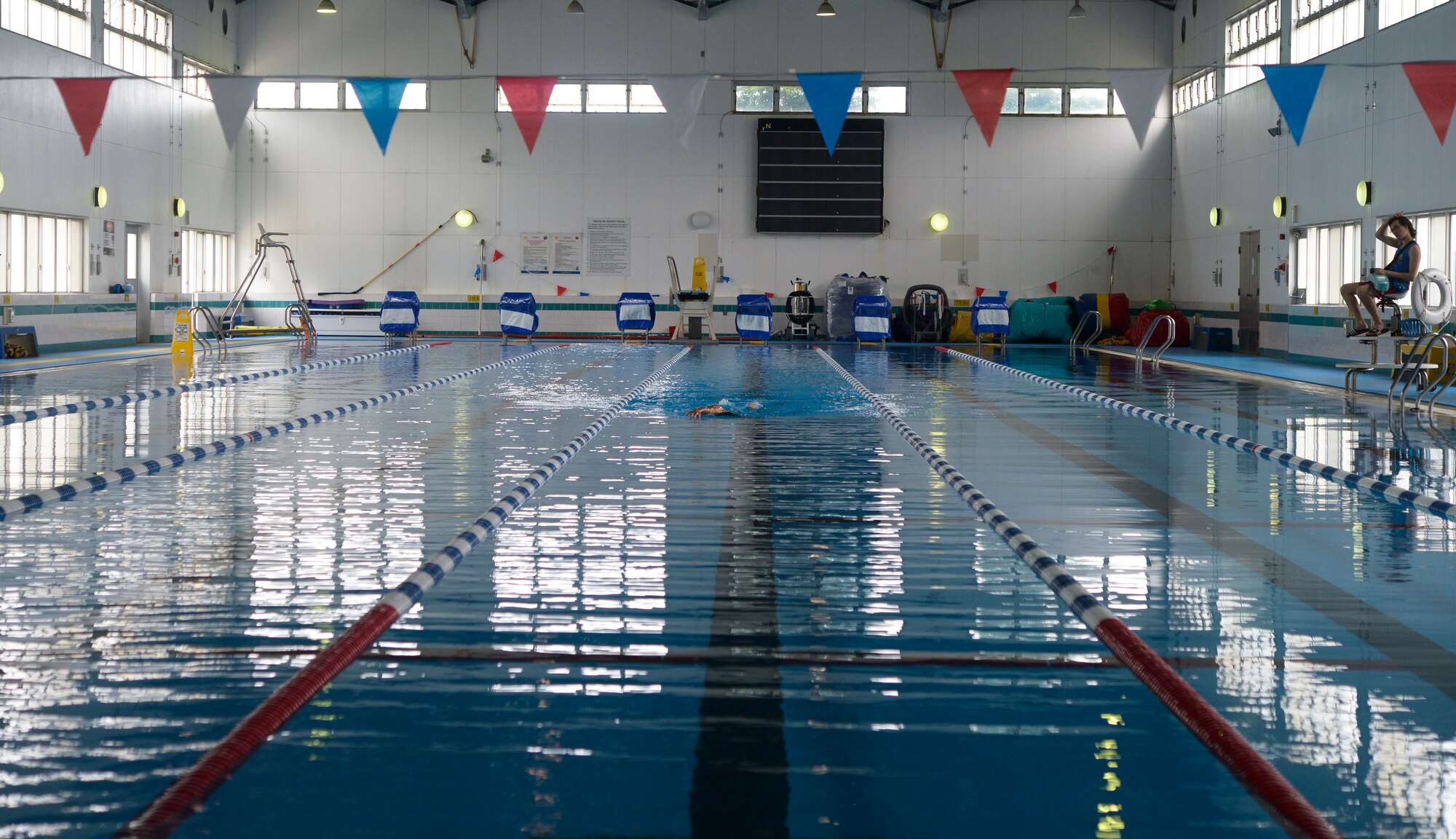 A member of Yokota Air Base, Japan, swims at the Natatorium Indoor Pool at Yokota AB, June 17, 2015. Swimming is a low-impact activity that has many physical and mental health benefits which provides a person with the ability to build endurance, muscular strength and cardiovascular fitness. (U.S. Air Force photo by Senior Airman David Owsianka/Released)
