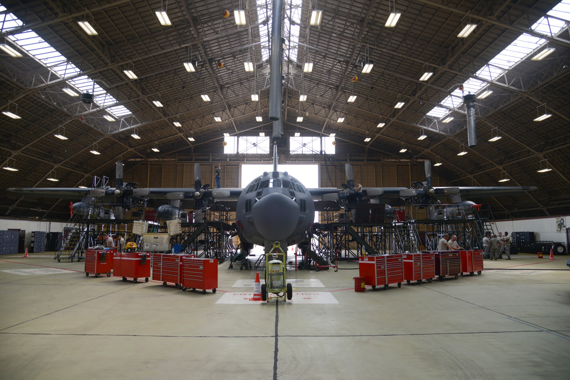 Members of the 374th Maintenance Squadron work on a MC-130H Combat Talon II from Kadena Air Base, Japan, at Yokota Air Base, Japan, June 16, 2015. The MC-130H provides infiltration, exfiltration and resupply of special operation forces and equipment in hostile or denied territory. (U.S. Air Force photo by Senior Airman David Owsianka/Released)