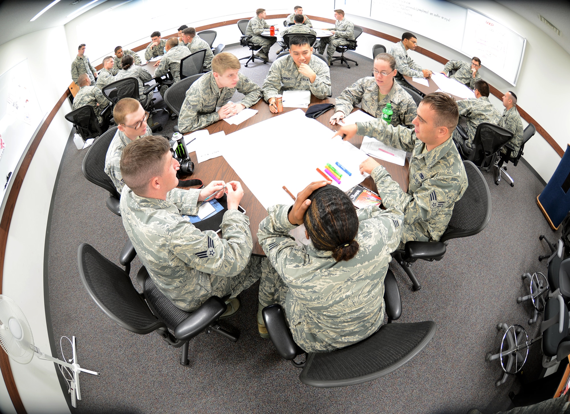 Airmen work together during a personality assessment session June 16, 2015, at the Professional Development Center at Yokota Air Base, Japan. The session titled the four lenses provides students at Airmen Leadership School an opportunity to discover their own personality and how to communicate with others. (U.S. Air Force photo by Senior Airman Desiree Economides/Released)