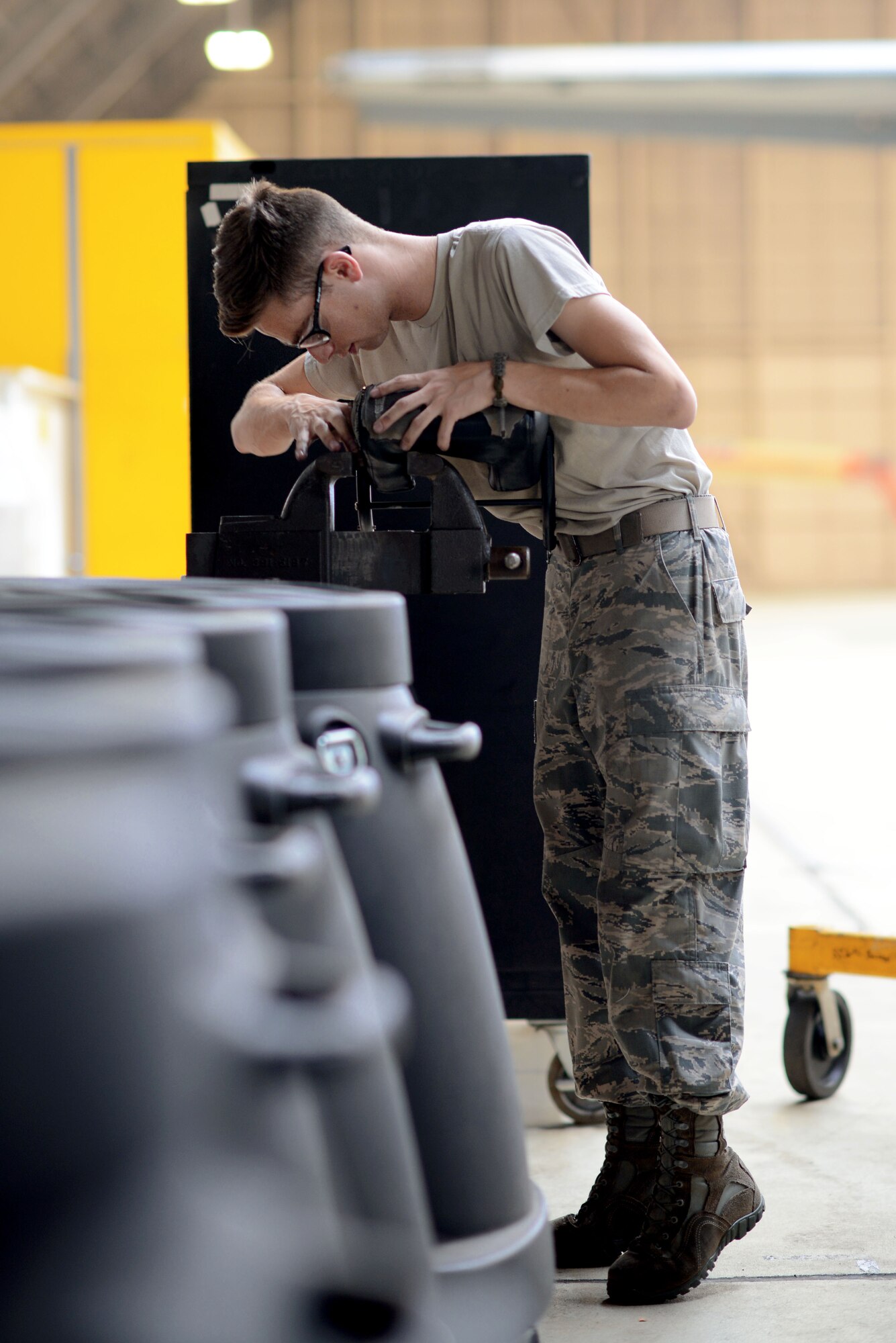 Senior Airman Michael Dalleo, 374th Maintenance Squadron crew chief, inspects a cushion from a C-130 Hercules, June 16, 2015, at Yokota Air Base, Japan. As part of the yearly isochronal inspection of a C-130 Hercules, 374 MXS Airmen worked to ensure the aircraft remains safe. (U.S. Air Force photo by Airman 1st Class Delano Scott/Released)