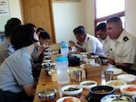 American and South Korean students in the first Korean National Defense University combined training course eat lunch at a Korean restaurant after a class trip to the Korean Demilitarized Zone. 